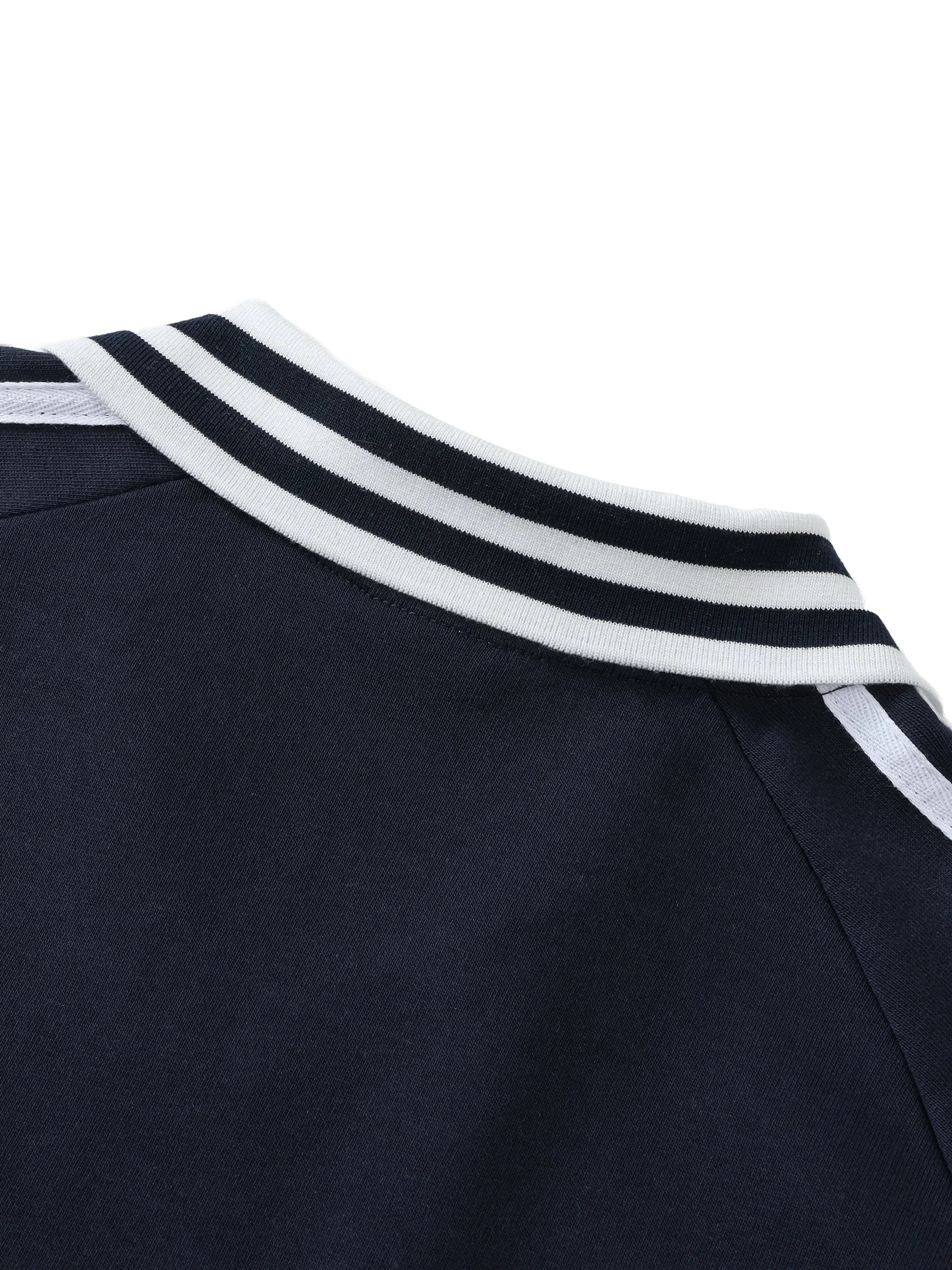 Navy blue sweatshirt with a white and black striped ribbed collar, close-up detail