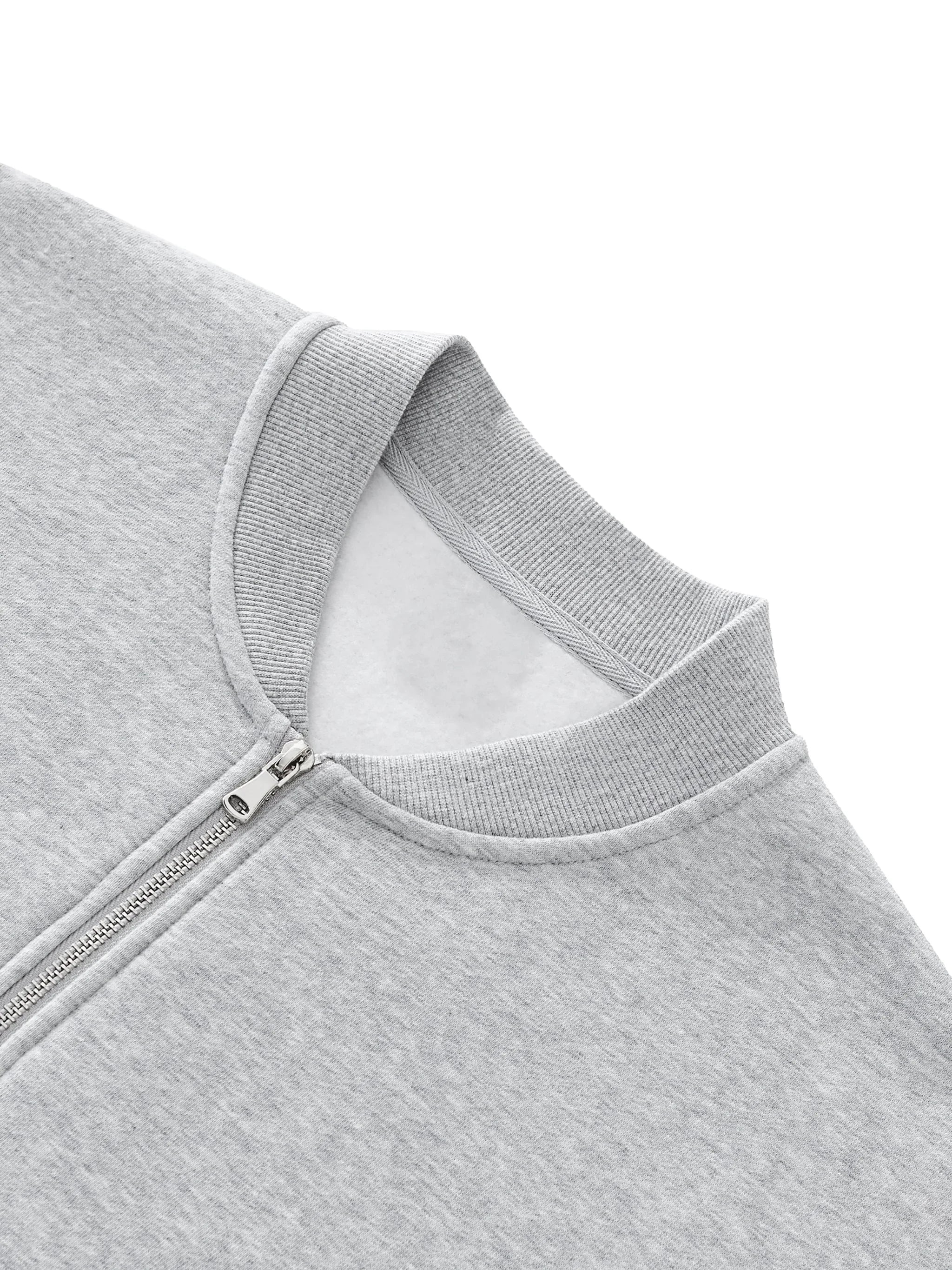 Close-up of light grey heavyweight zip-up sweatshirt collar and zipper detail