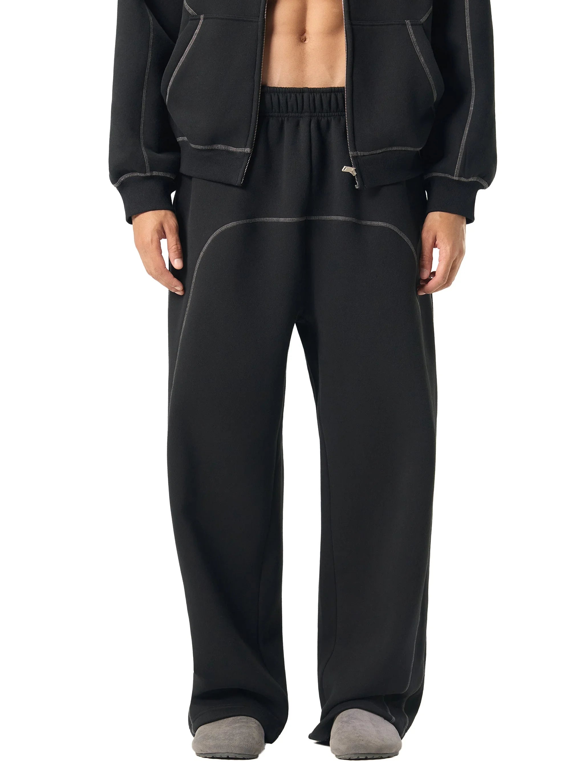 Men's black heavyweight sweatpants with contrast stitching and relaxed fit