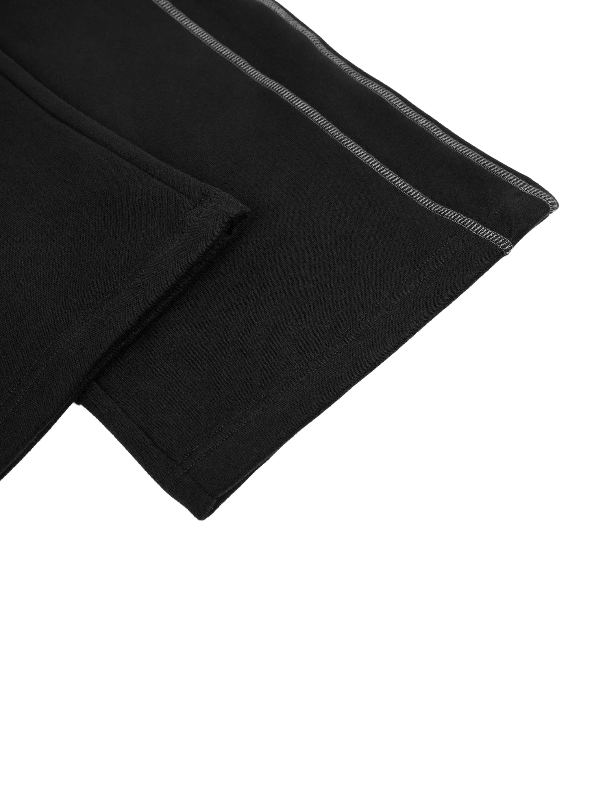 Close-up of black heavyweight streetwear fabric with contrast stitching detail