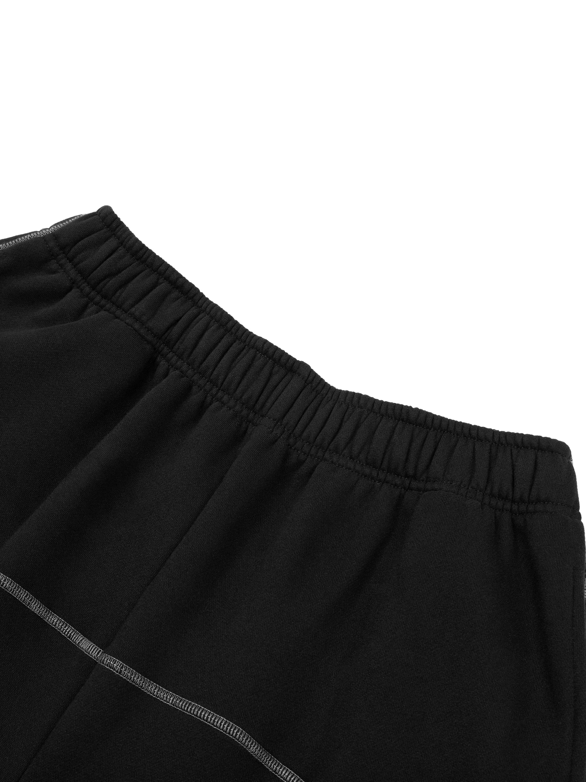Black heavyweight sweatpants with elastic waistband and white contrast stitching detail