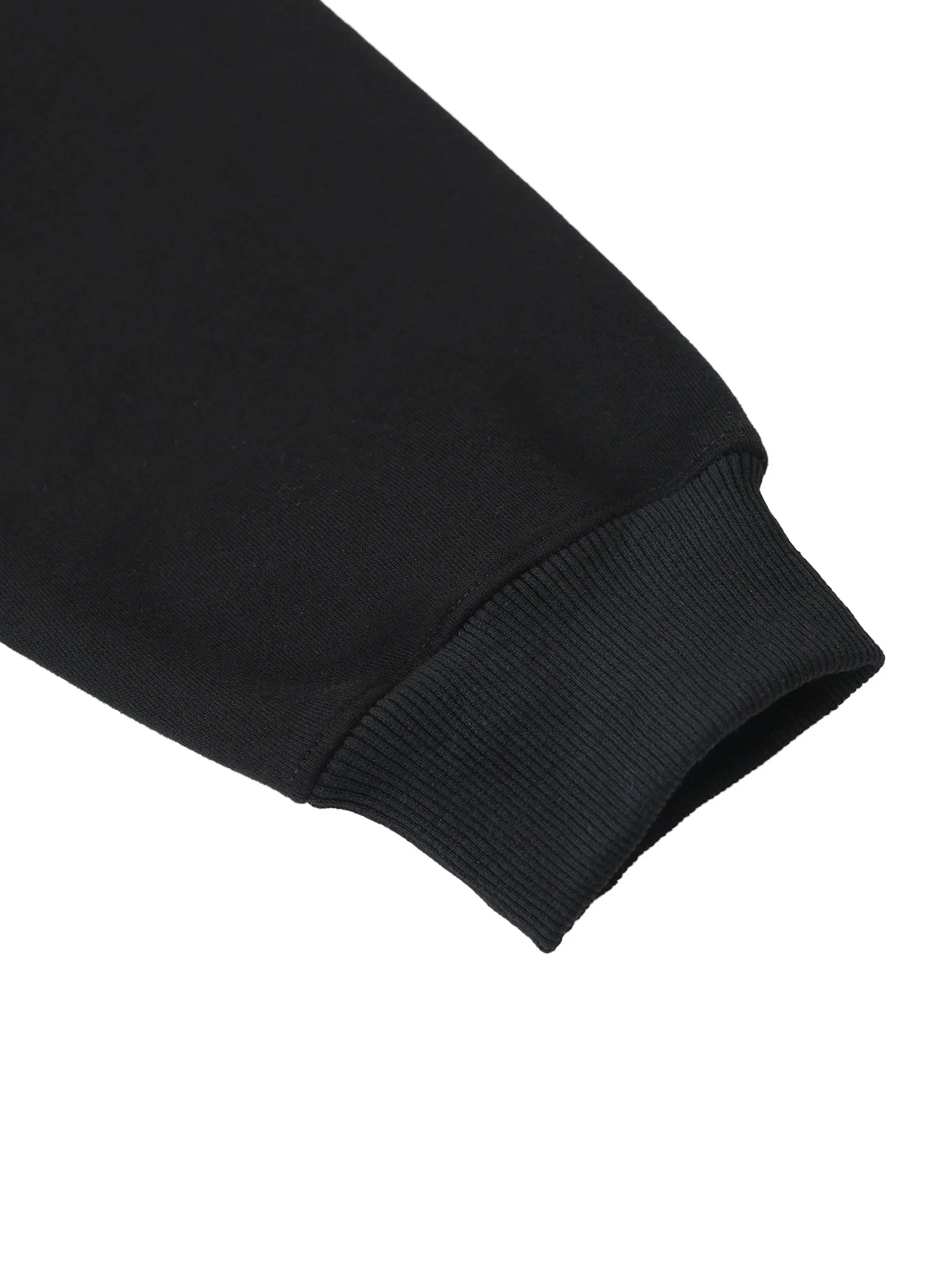 Close-up of black heavyweight hoodie sleeve with ribbed cuff, luxury streetwear detail