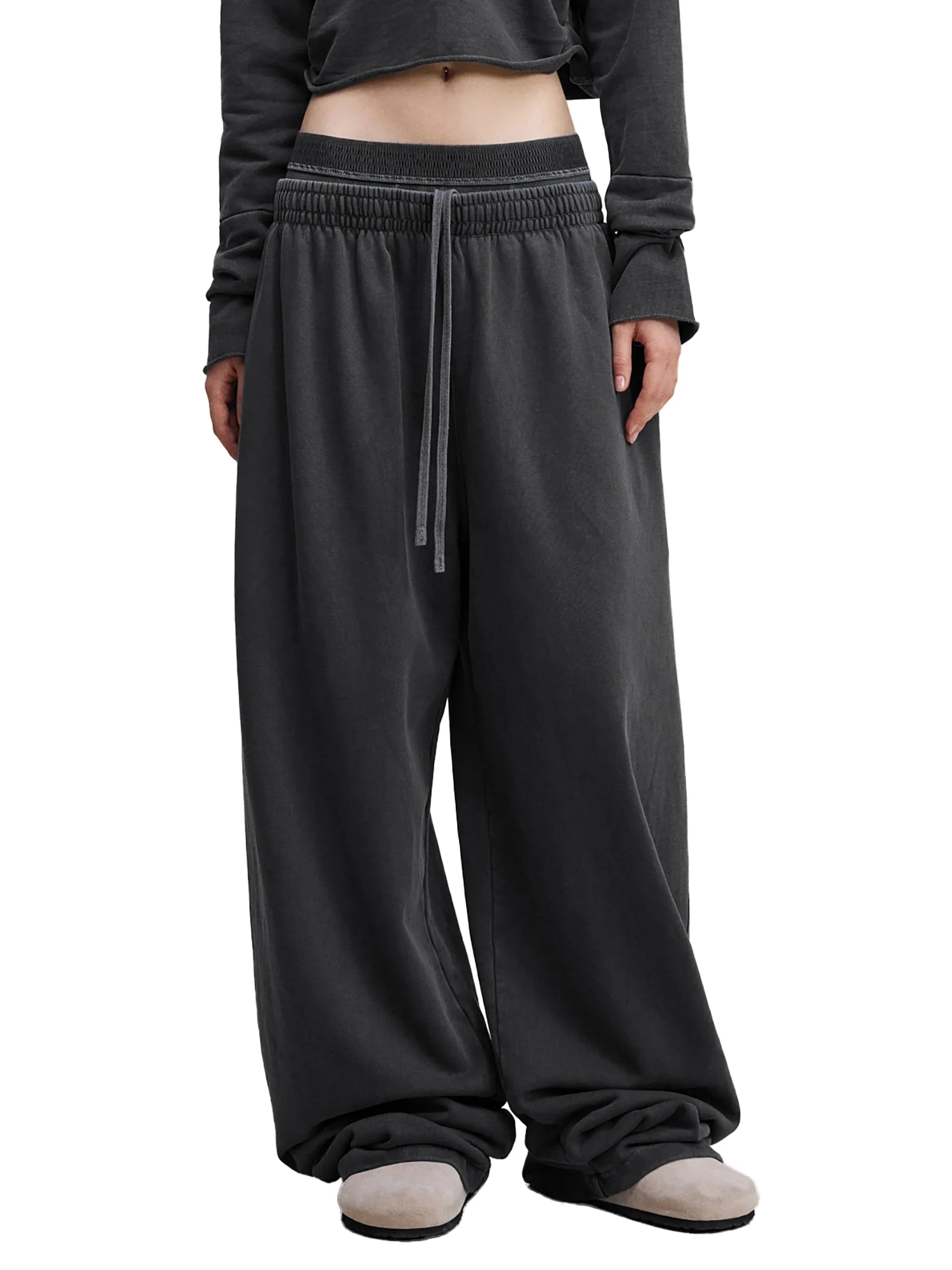 Wide leg black sweatpants with elastic waistband and drawstring, streetwear style