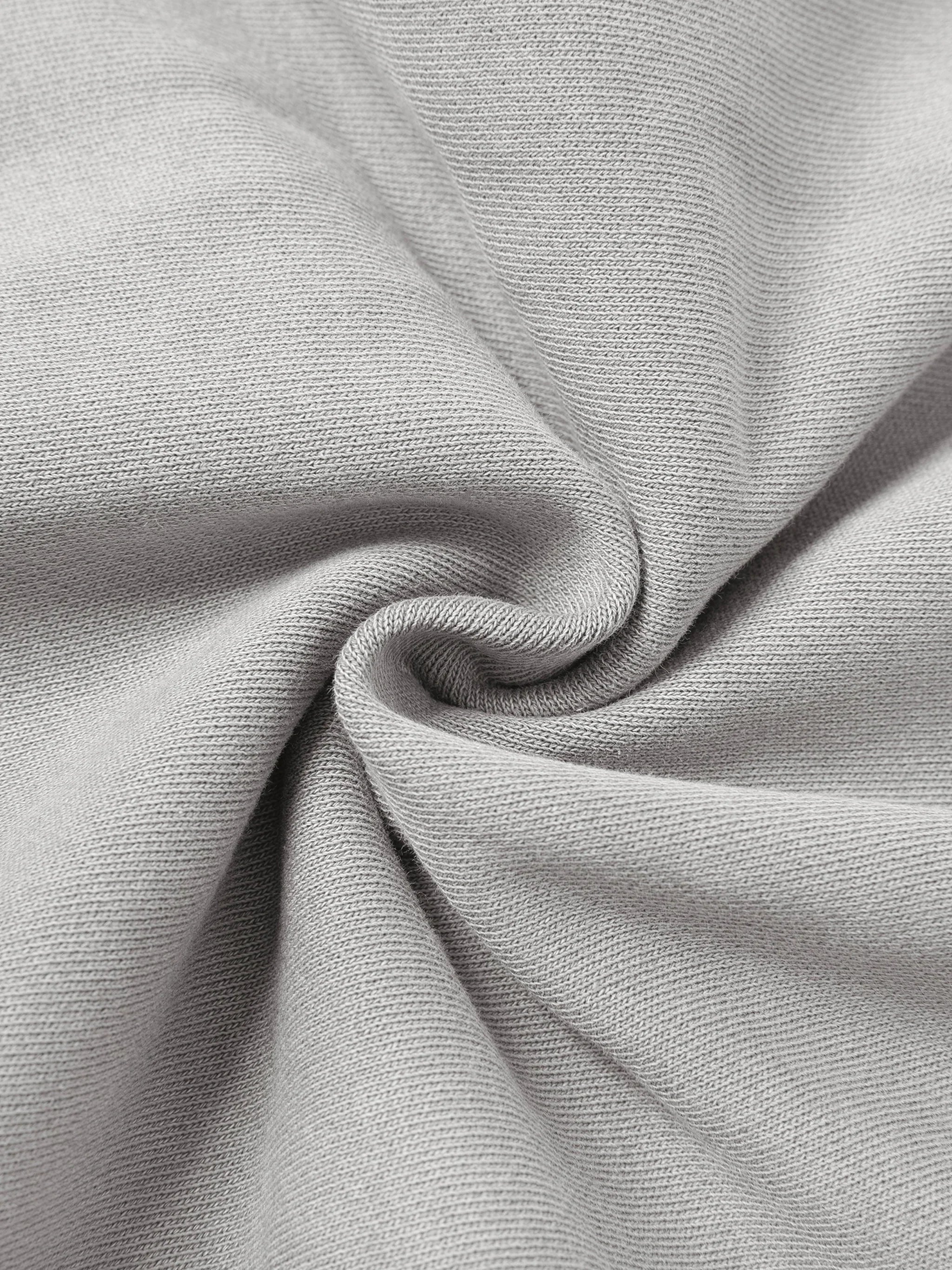 Close-up of light grey heavyweight cotton fabric with textured, soft knit and modern twist