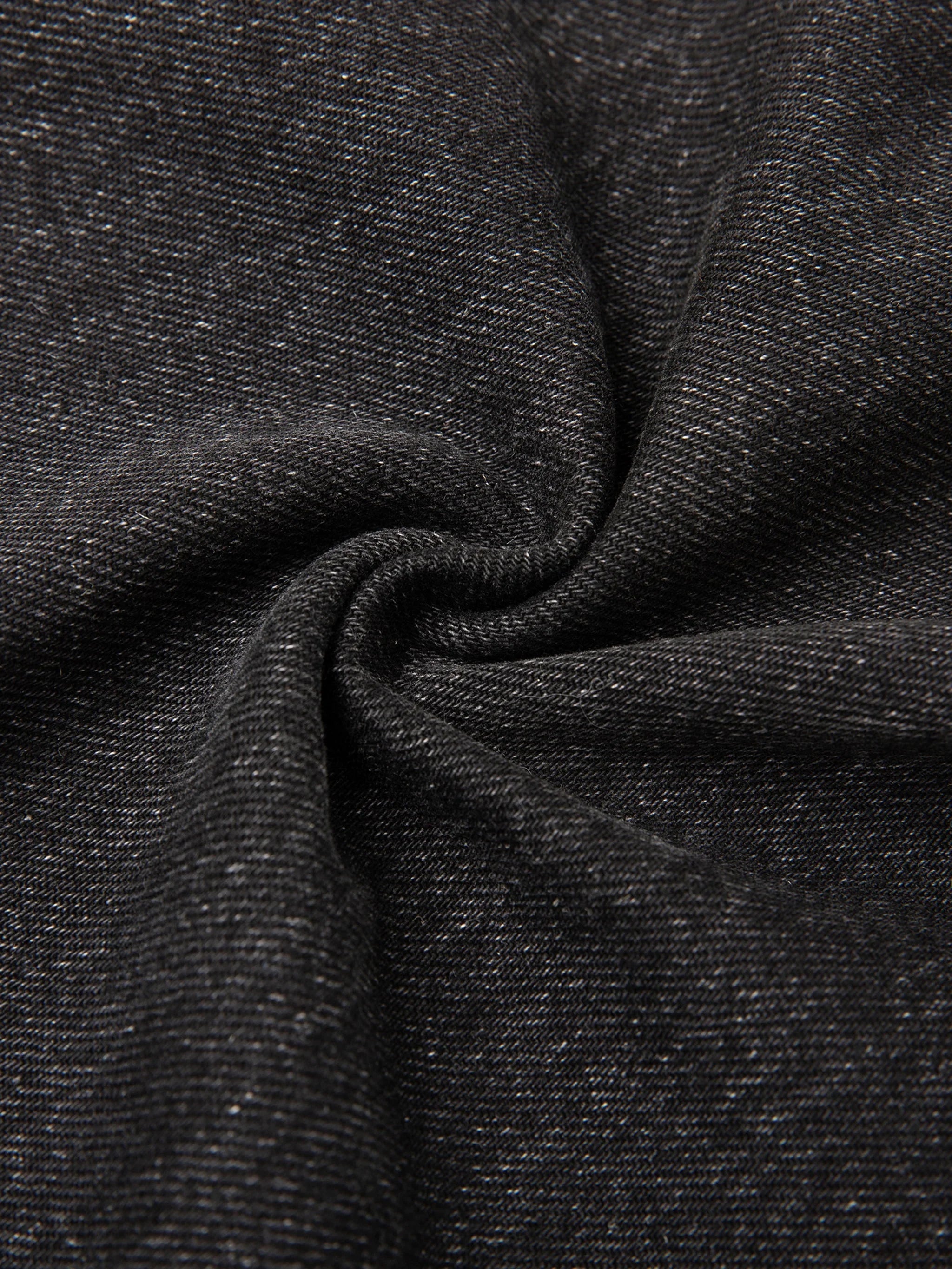 Close-up of heavyweight black heather hoodie fabric texture in spiral pattern