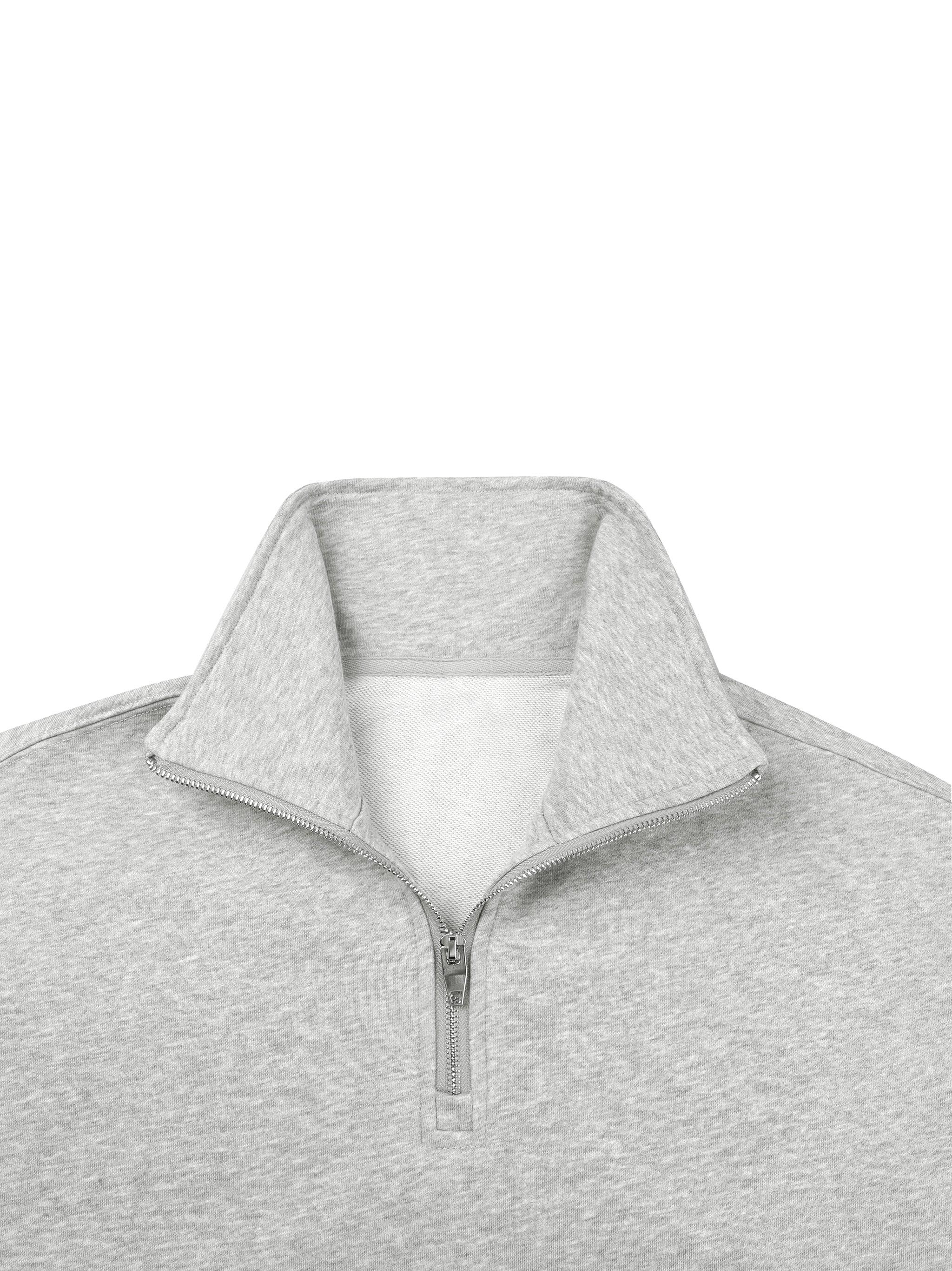Light grey quarter-zip sweatshirt with stand-up collar and soft fleece interior