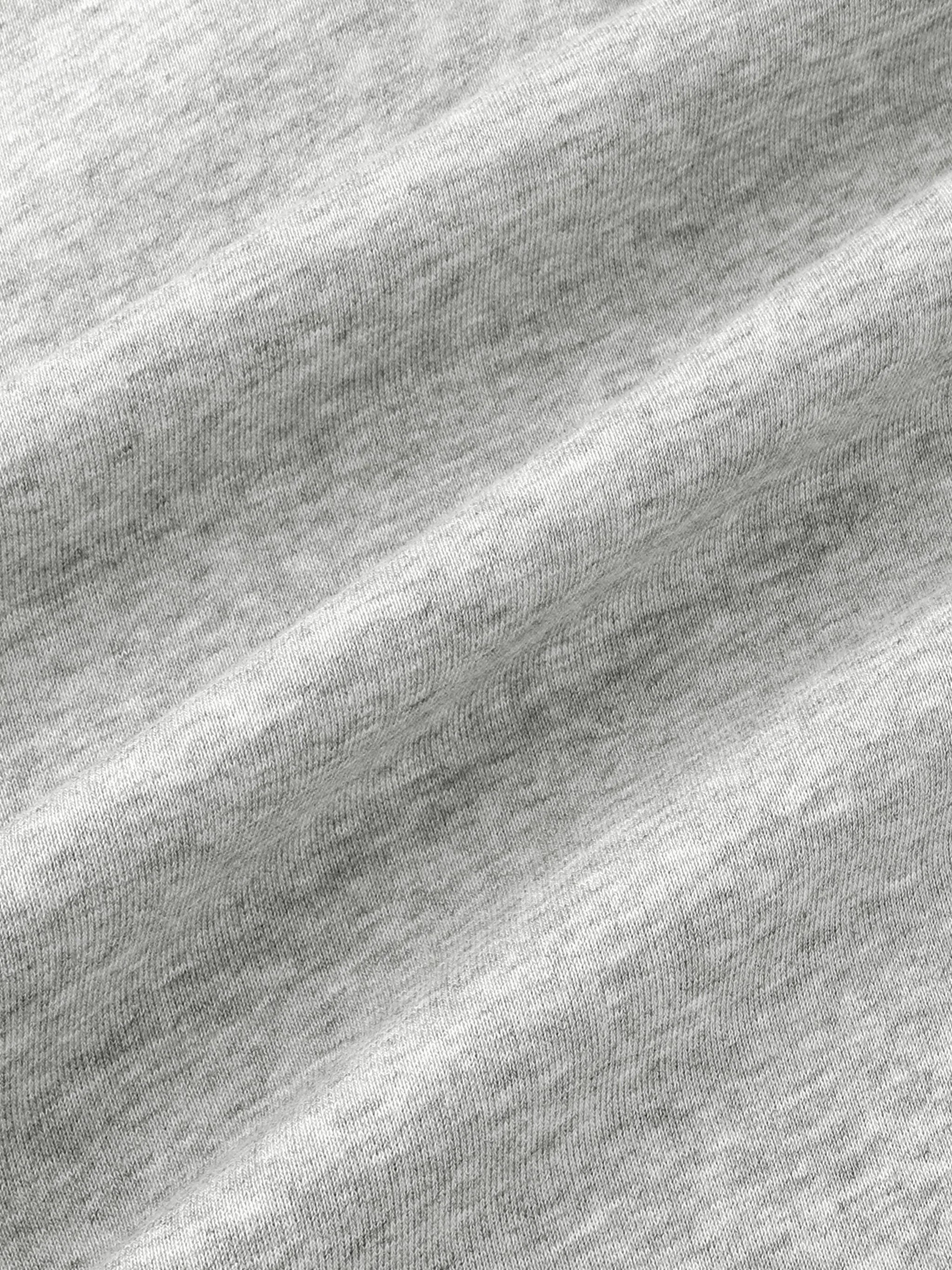 Close-up of light grey heavyweight cotton fabric with textured knit pattern